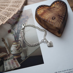 FLOWER HEART BRACELET ON DOUBLE CURB CHAIN